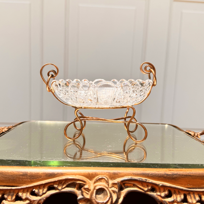 Antique Baccarat catchall, straight-on view from front at level showing brass spiral mounting detail and the crystal edge and details, placed on mirror surface
