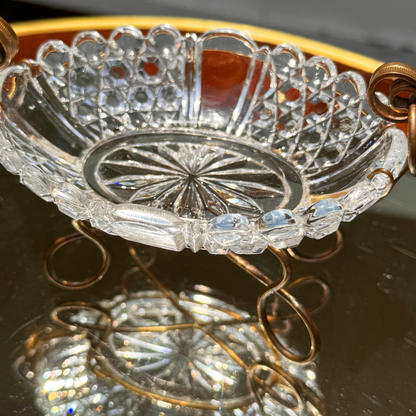 Antique Baccarat crystal catchall close up on the crystal bowl from slightly above angle