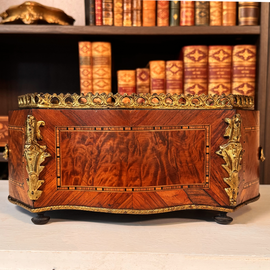 Antique miniature French marquetry jardinière with gilt bronze gallery and mounts, front view, books displayed behind