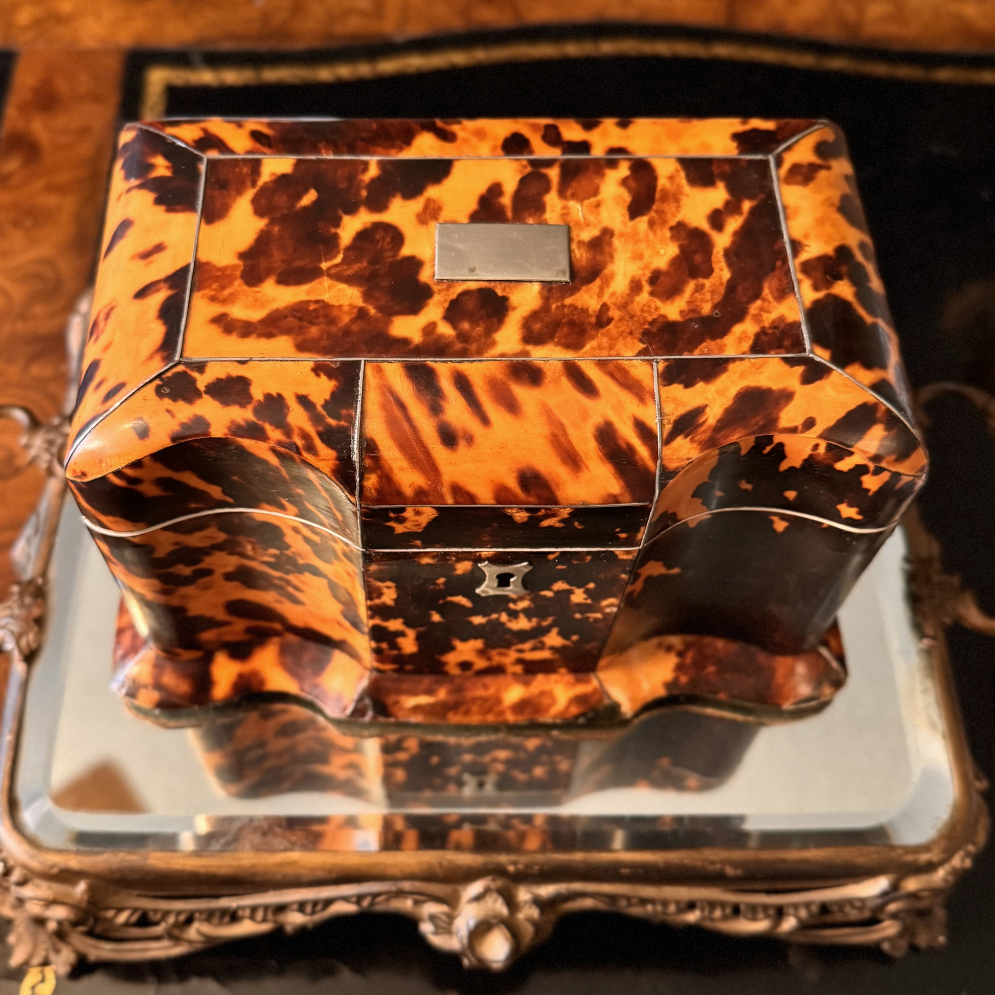 Tortoiseshell-patterned box on a decorative tray

