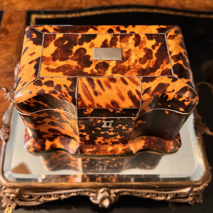 Tortoiseshell-patterned box on a decorative tray

