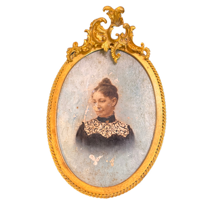 portrait of a woman in a gold frame on a white background