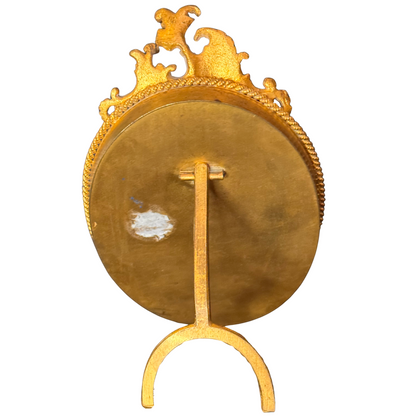 Gold frame from back view with a kickstand on a white background